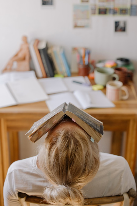 Image of woman overwhelmed by studying